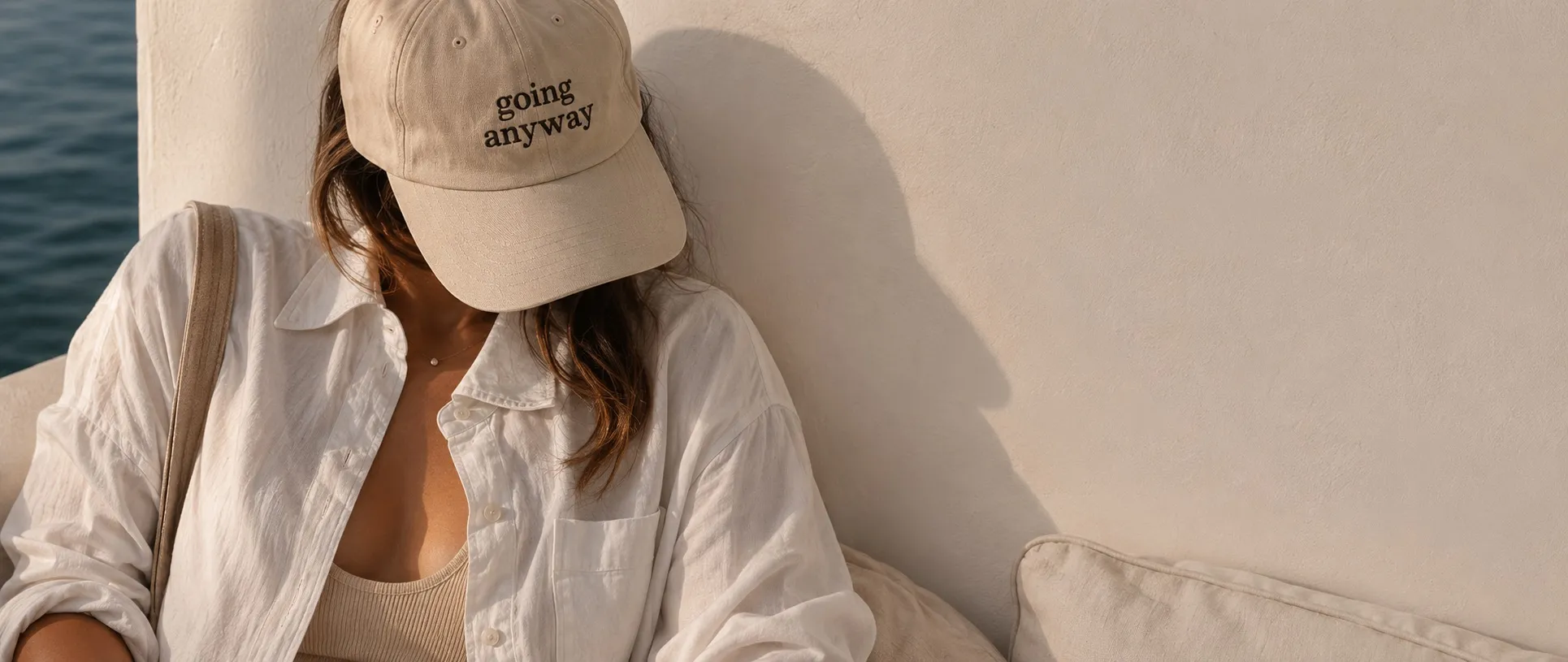 Going Anyway lifestyle image with a neutral cap and linen shirt