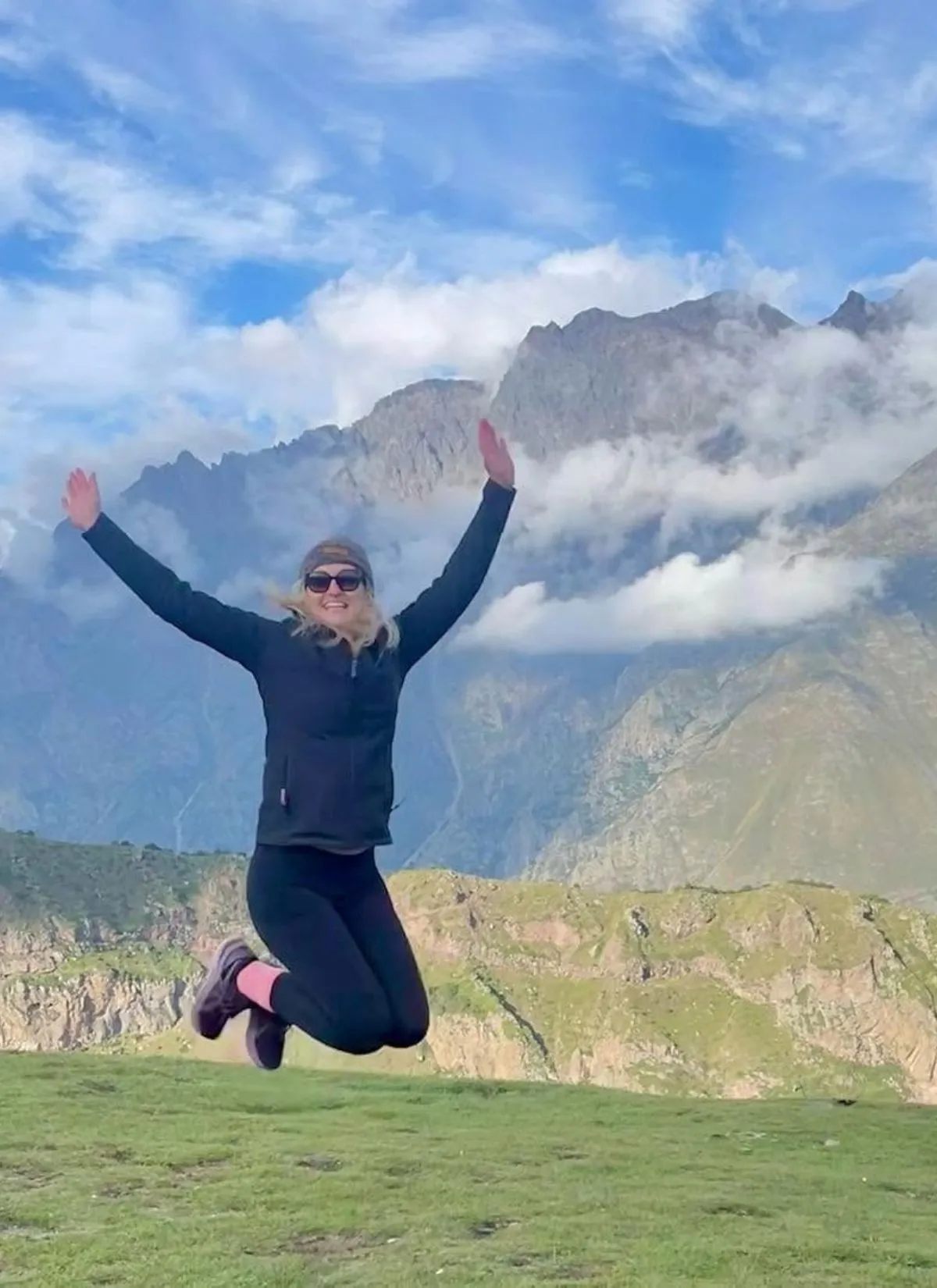 Jen jumping during a hike in Georgia